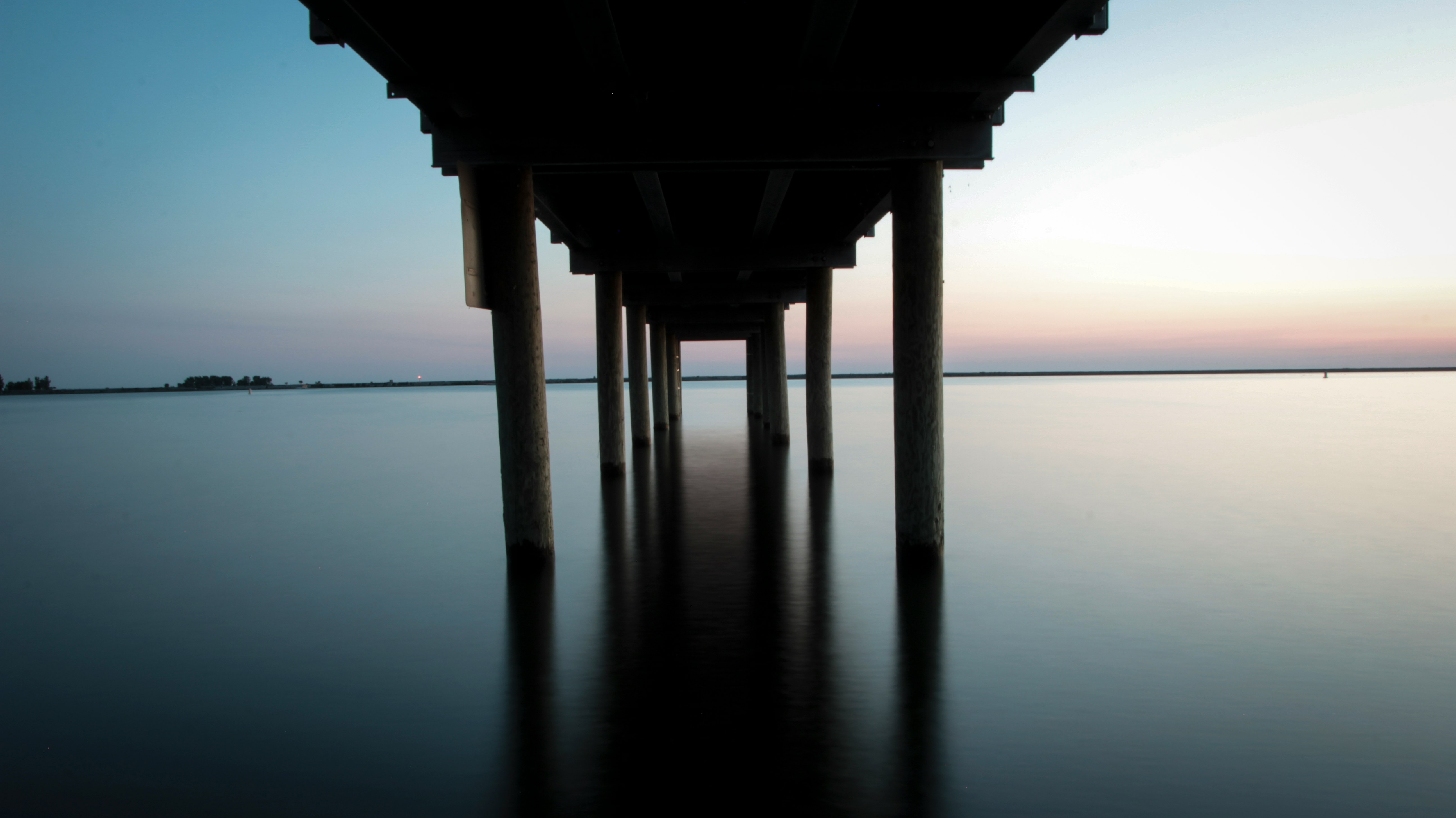 wooden dock on body of water